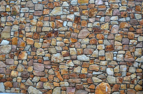 Каменная стена из натуральных камней — стоковое фото