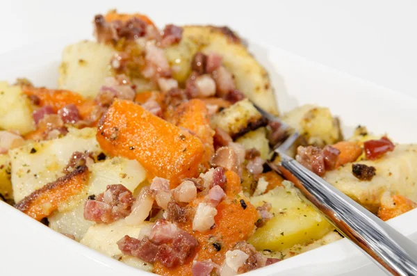 Roasted root vegetable with bacon — Stock Photo, Image