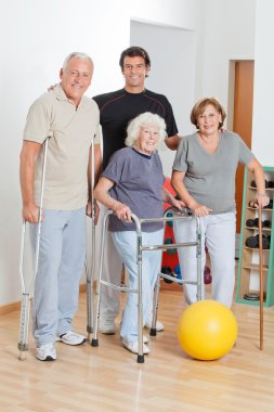 Portrait Of Disabled Senior With Trainer clipart