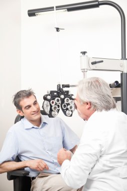 Optometrist doing Sight Testing clipart