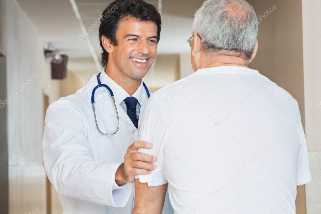 Doctor Assisting Senior Man
