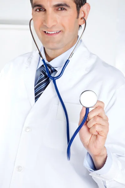Male Doctor Holding Stethoscope Royalty Free Stock Images