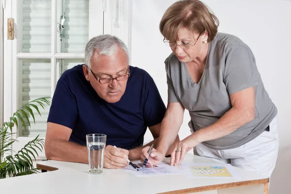 Mature Couple playing Scrabble Game — Stock Photo, Image