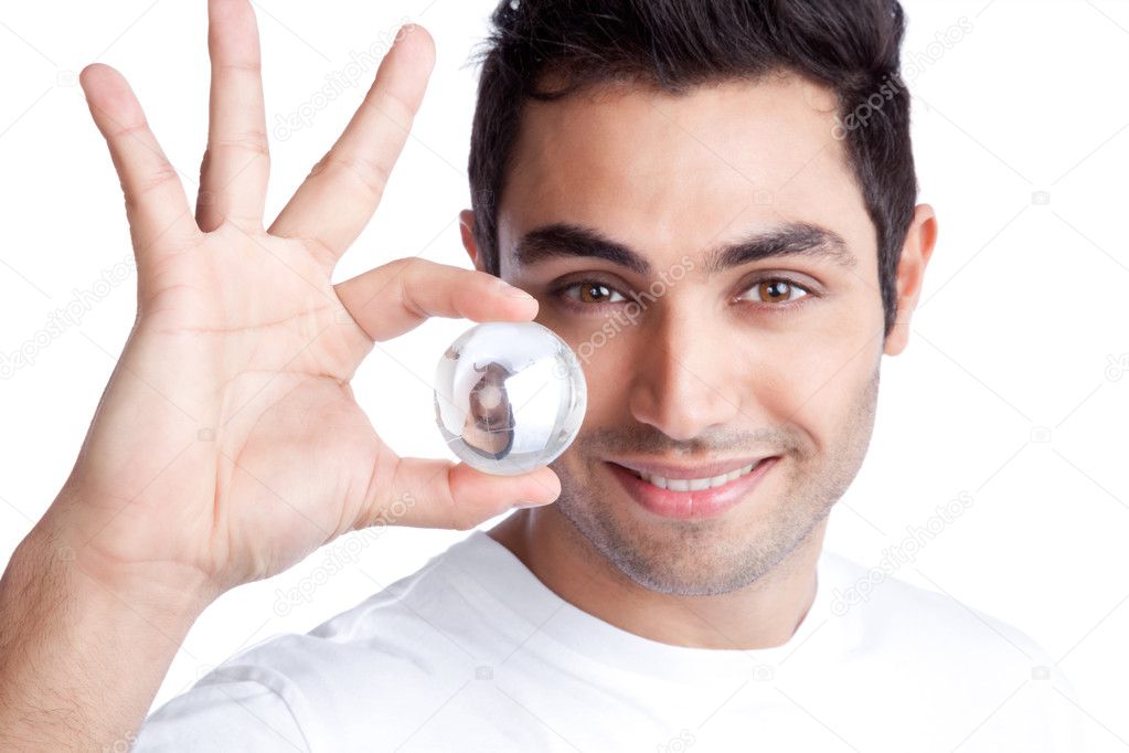Young Man Holding Crystal Ball — Stock Photo © SimpleFoto 11202070
