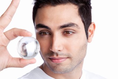 Young Man Holding Crystal Ball clipart