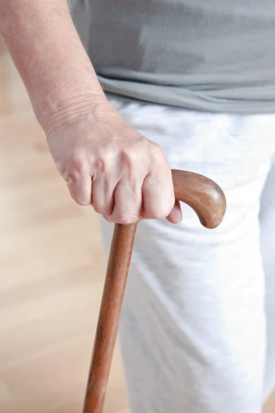 Mulher idosa com vara ambulante — Fotografia de Stock