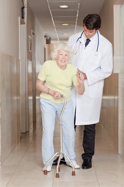 Doctor helping Patient use Walking Stick — Stock Photo, Image