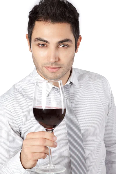 Бизнесмен, держащий стакан красного вина — стоковое фото