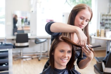 Hairdresser Cutting Client's Hair