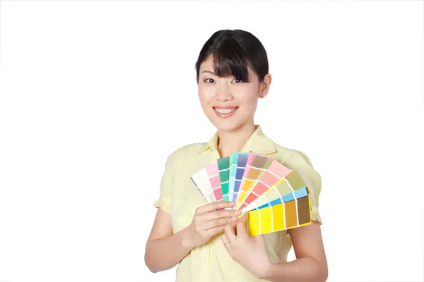 Kleurenoverzicht voor jonge vrouw weergegeven: — Stockfoto