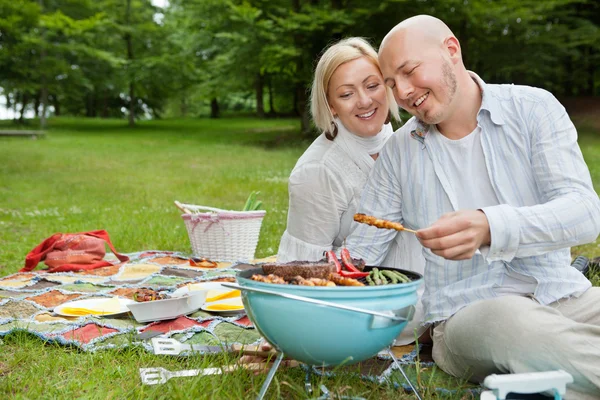 Couple Cooking Meat On Barbecue — Stock Photo, Image