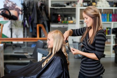 Woman Getting a New Hairstyle clipart