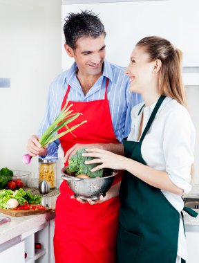 Man and Woman Cooking in Kitchen clipart