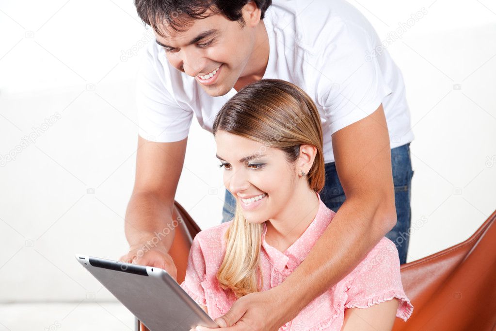 Young Couple Using Digital Tablet