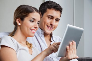 Young Couple With Tablet PC clipart