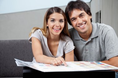 Couple Choosing Color Samples clipart