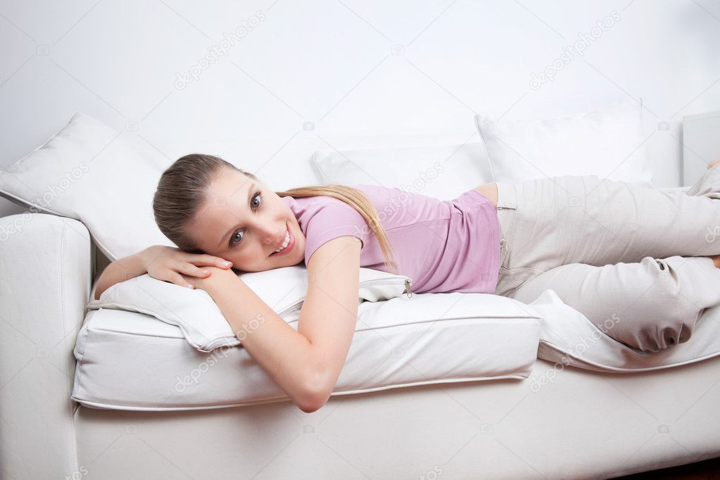 Young Woman Lying on Couch