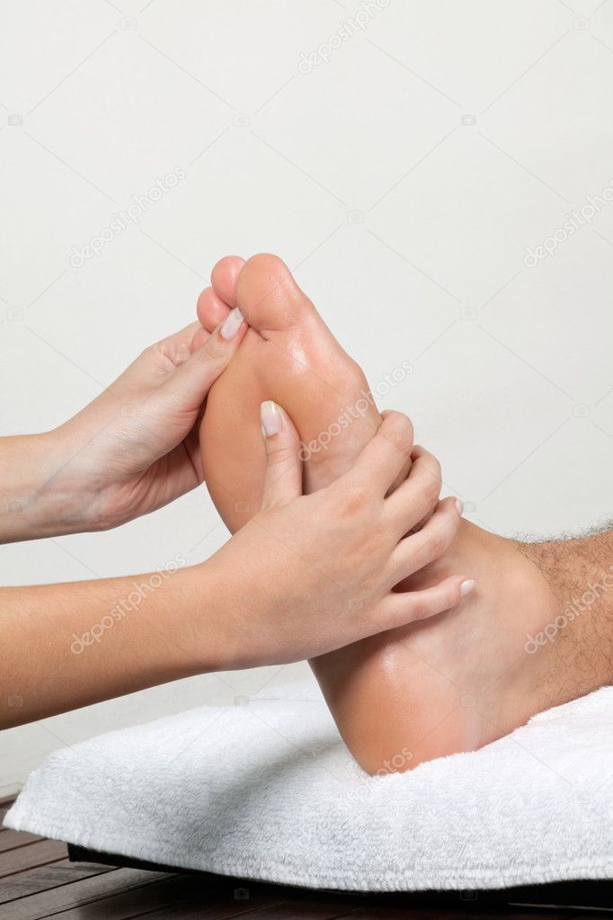 Woman Massaging Foot