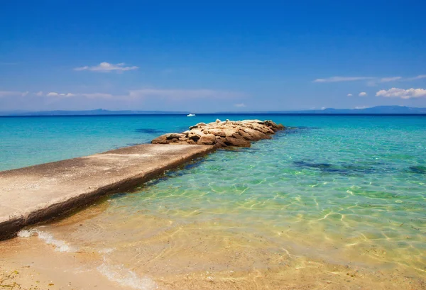 Pier and beach in Halikidiki — Stock Photo, Image