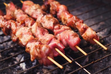 Pork skewers on a grill clipart