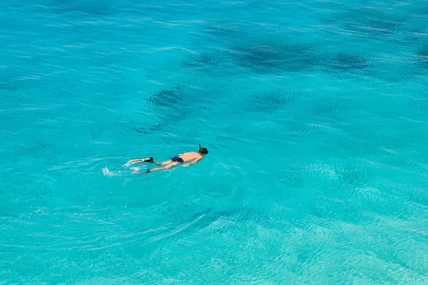 stock image Unrecognizable man snorkeling at Porto Katsiki beach