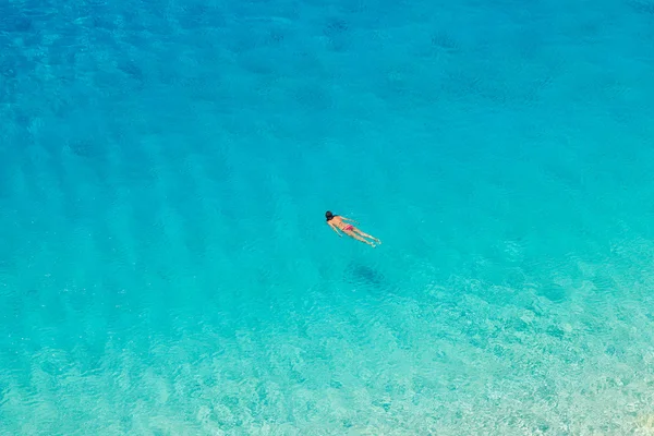 Stock image Unrecognizable woman swimming at Porto Katsiki beach