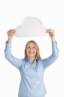 Female holding a paper cloud and smiling clipart