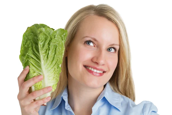 Attractive smiling woman holding fresh lettuce — Stock Photo, Image