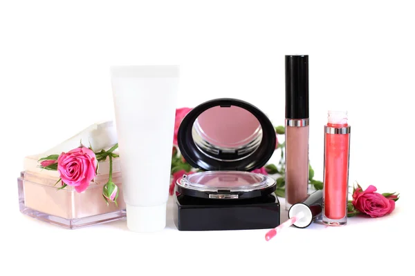 Cosmetics - makeup powder, cream, blush, lip gloss and flowers — Stock Photo, Image