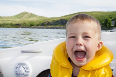 Travel of children on water in the boat clipart