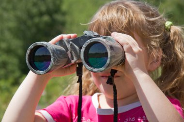 Child and nature. Environment supervision in the field-glass. clipart