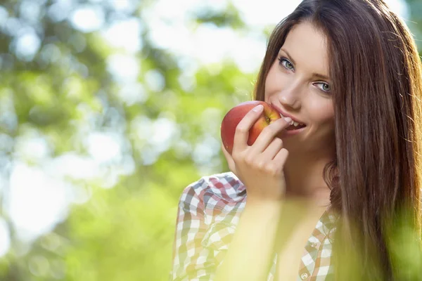 Beautiful woman in the garden with apples Royalty Free Stock Photos