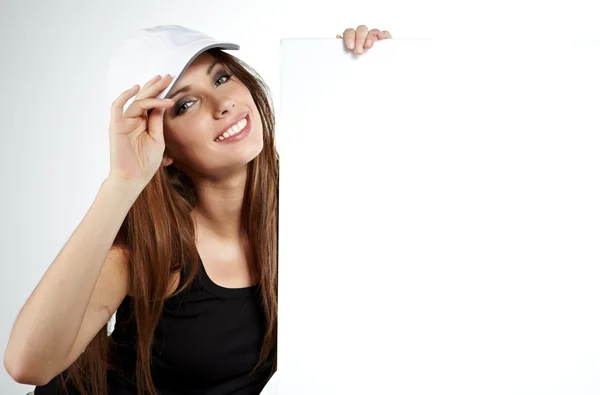 Sexy woman holding a blank billboard. — Stock Photo, Image