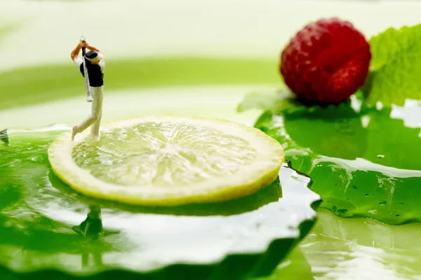 Miniature golf on fruits — Stock Photo, Image