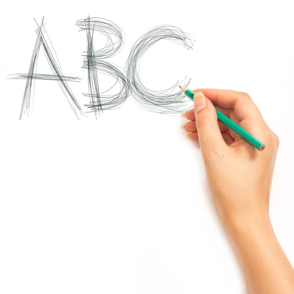 Mano de mujer sosteniendo un lápiz y escribiendo alfabeto ABC — Foto de Stock