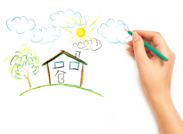 Woman's hand drawing the dream home — Stock Photo, Image