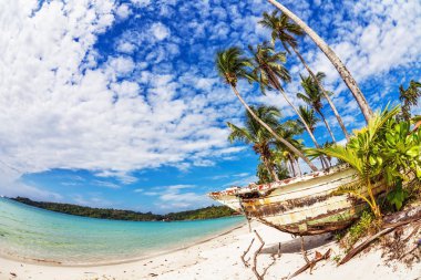 Old Thai boat at the beach clipart