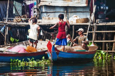 Fisherman with their children prepare tackle clipart