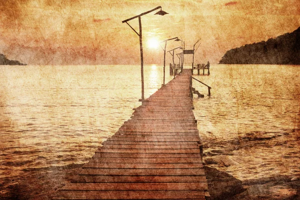 Sunset over the sea in grunge style — Stock Photo, Image