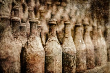 Old wine bottles covered with dust in retro style clipart