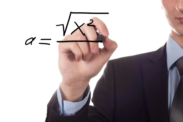 Учитель пишет математическое уравнение — стоковое фото