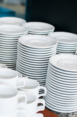 Catering. saucers, and cups of tea. clipart