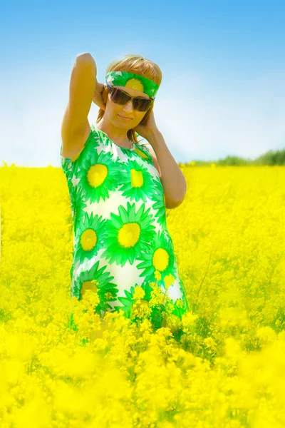 stock image Beautiful woman on rape field