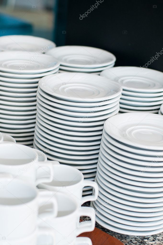 Catering. saucers, and cups of tea.