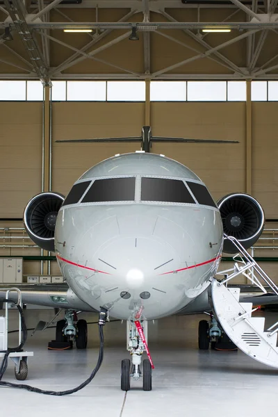 Private Jet in hangar — Stock Photo, Image