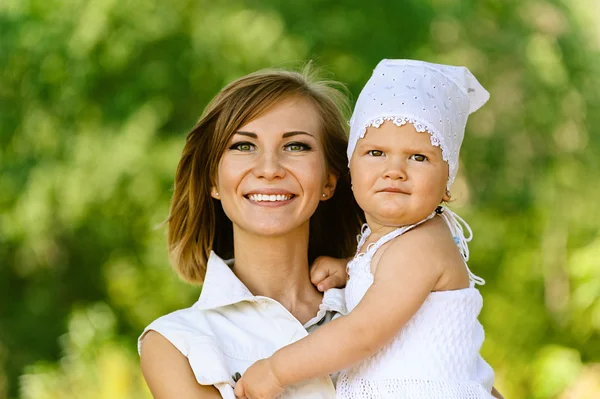 Young woman and her little daughter — Stock Photo, Image