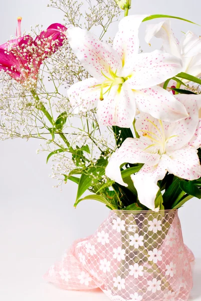 White and pink lily flowers and lace — Stock Photo, Image