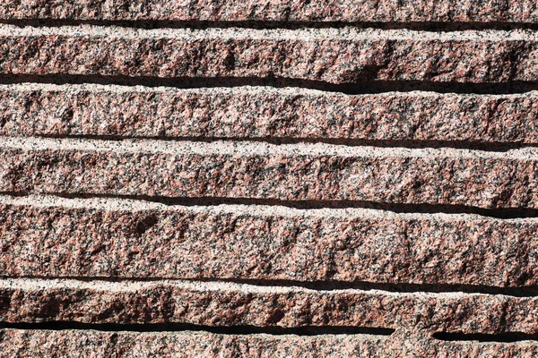 Closeup of surface reddish granite block — Stock Photo, Image