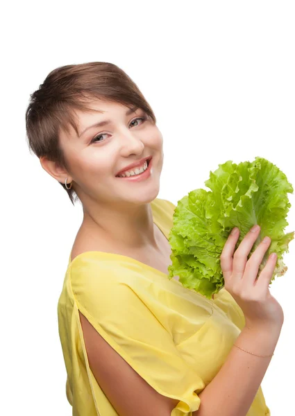 Das Mädchen wird von einem Salatblatt verschlossen — Stockfoto