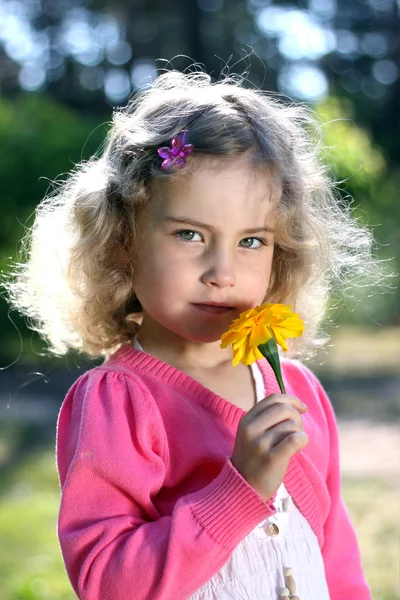 Lovely girl with a flower — Stock Photo, Image